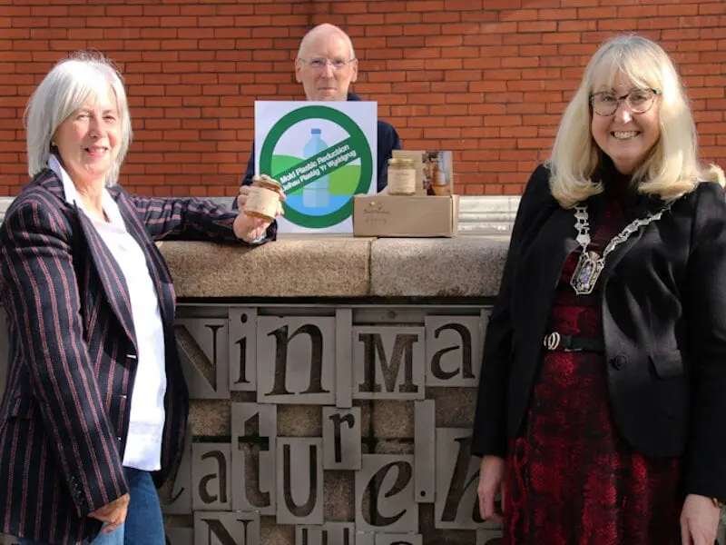 Honey handover: MPR newsletter prize winner Susan Broadaway with Mayor of Mold Teresa Carberry and newsletter editor Eric Davies pictured in Daniel Owen Square