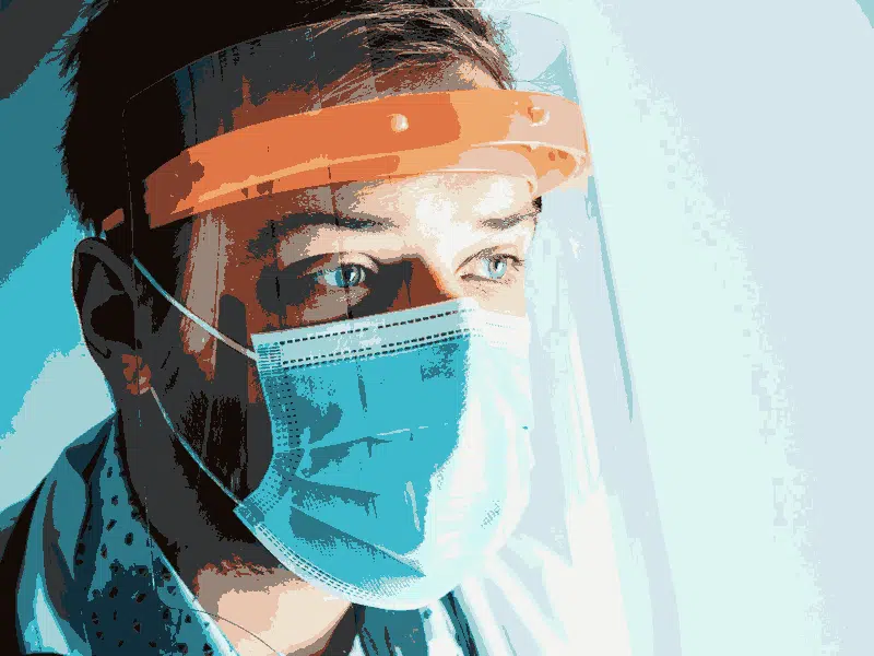 Doctor wearing face mask and visor.
