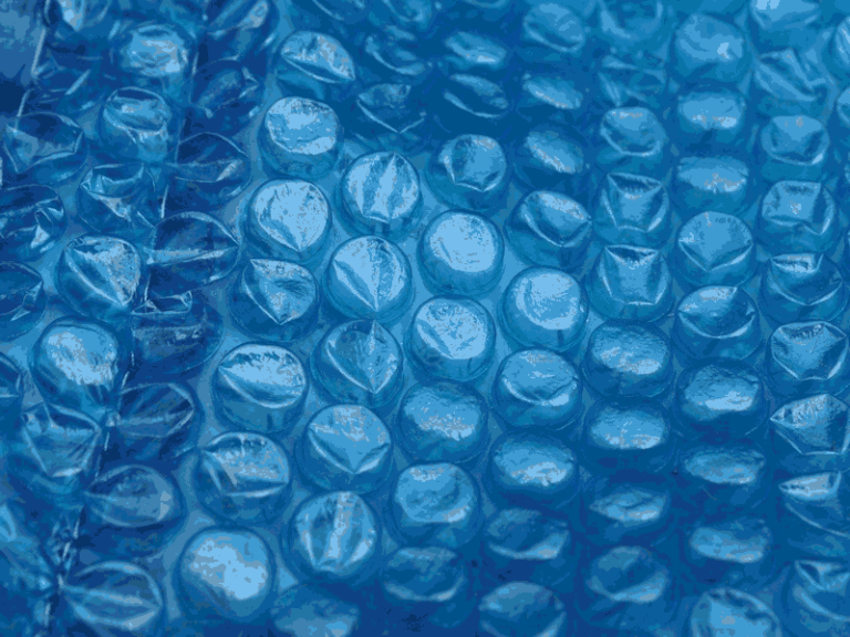 Close up shot of blue bubble wrap.