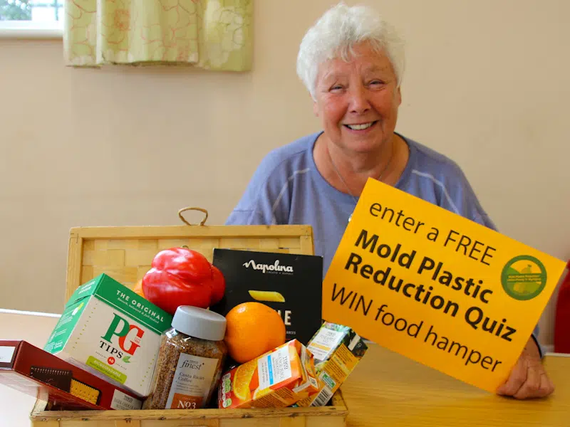 Pat Mee from Rhosesmor and the prize hamper of food she won in the Mold Plastic Reduction quiz at Mold Carnival 2023.